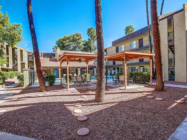 Outdoor covered areas with grills and tables