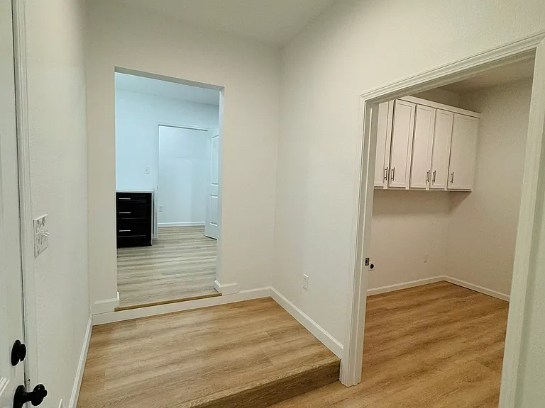 HAll to Master and Laundry and up stair to Kitchen
