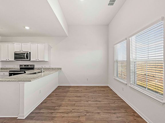 Dining room and adjoining kitchen
