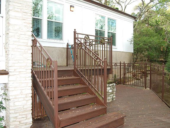 Porch off of Living area with steps to pool.