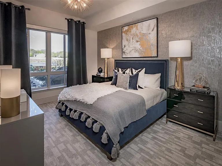 Beautiful master bedroom with large windows