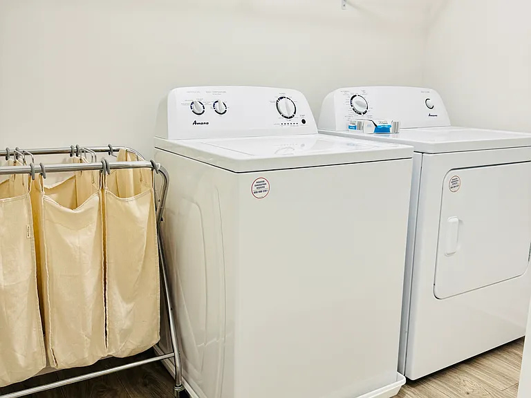 Convenient in-unit laundry room with full-size washer and dryer.