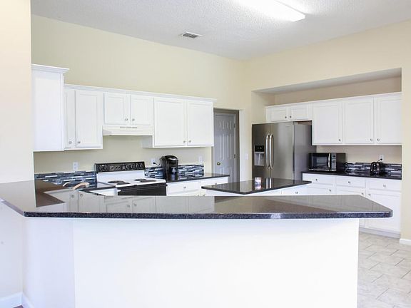 kitchen with large eat at bar