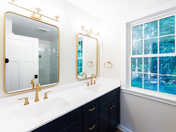 Primary bath with large windows and double sink. Brand new everything.