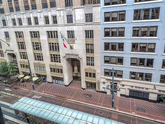 Looking from St Germain #501's windows down onto MetrRail station below, which easily connects you to many parts of the city. The great Jones building on the right built by historic Houston developer and leader, Jessie Jones. The building on left is 
