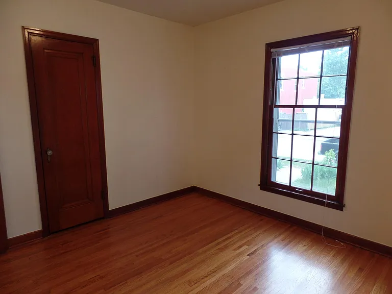 Front Bedroom with closet. Window faces street.