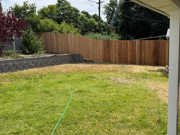 Yard - wood fence replaced July 2026, vinyl fence on back and street sides