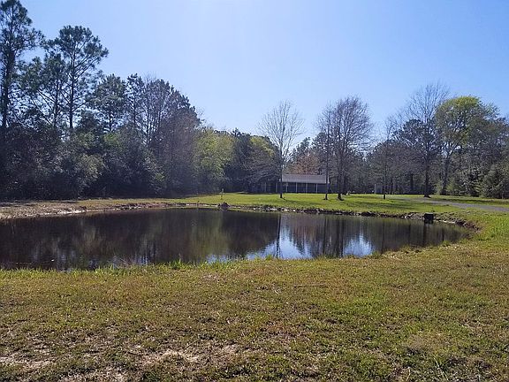Expansive yard with pond