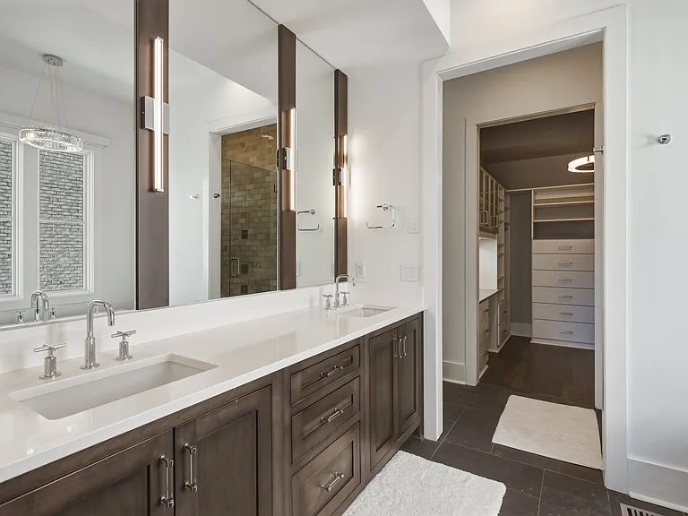Bathroom #1 is attached to the master bedroom with a dual vanity and stand alone shower + tub. Plus a huge California closet with custom built-ins.