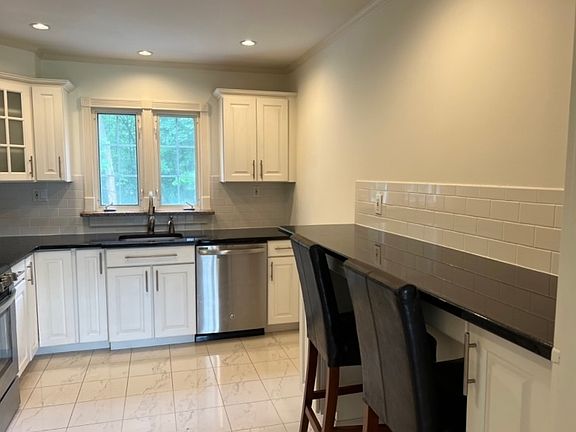 Updated kitchen with breakfast bar.