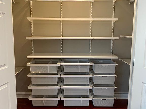 Kitchen pantry closet with customizable shelving included