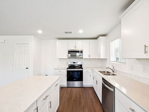 Spacious kitchen with abundant cabinet space photos are not of actual home, some features vary