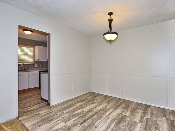 Dining space with wood tile.