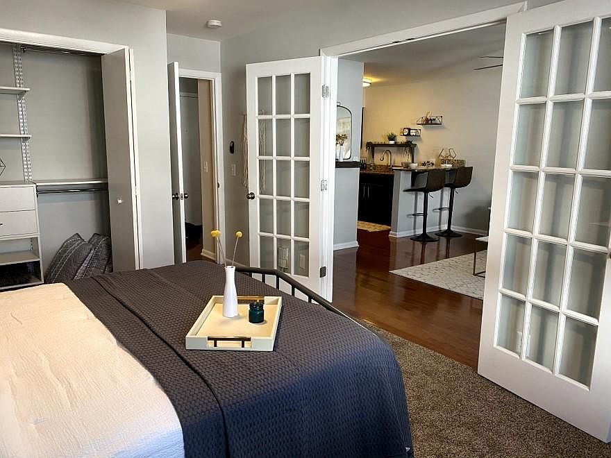 View from bedroom through french doors into LR/kitchen.