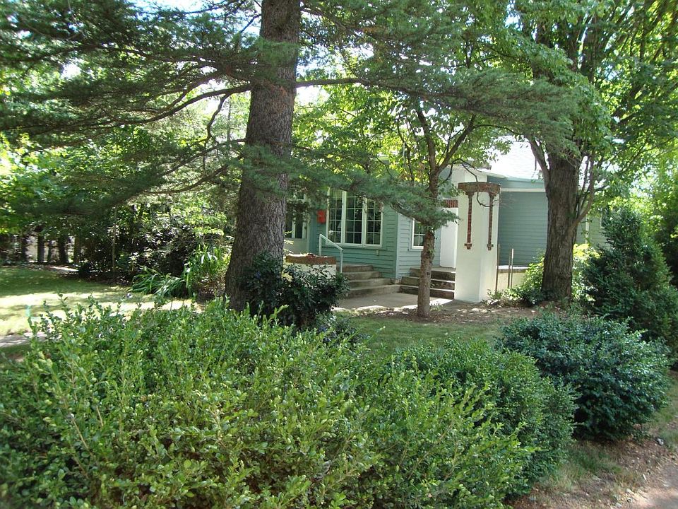 front entrance through landscape