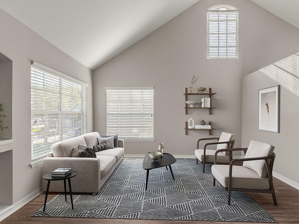 Experience the serene elegance of this spacious living room, designed for modern comfort.