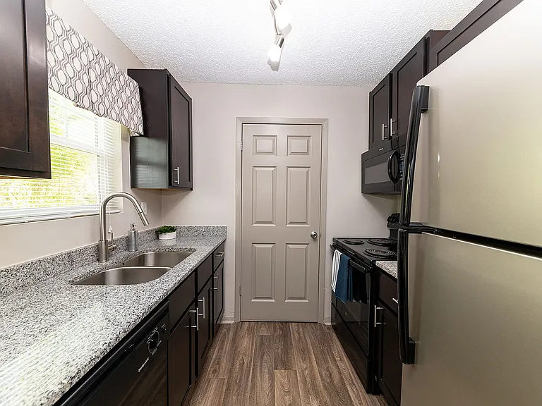 Kitchen with granite counters and stainless appliances