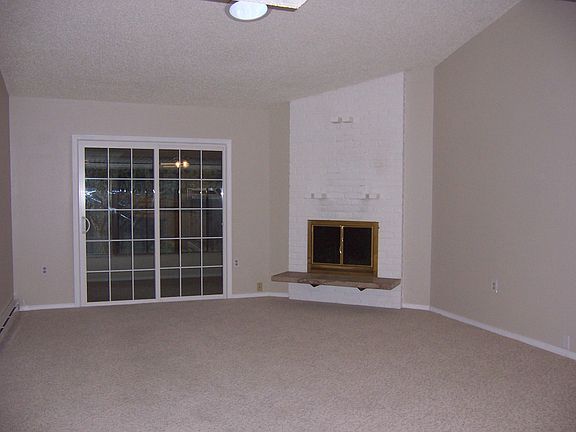 Living Room (Fireplace & Slider to Den/Sunroom)