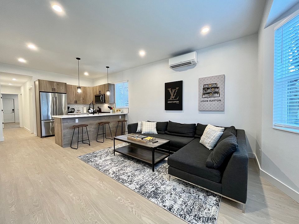Entertain in style: A spacious open layout where the living area seamlessly blends with a countertop-turned-island, creating the perfect dining spot.