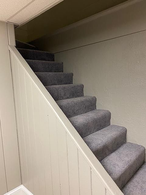 Stairway to finished basement; new carpet
