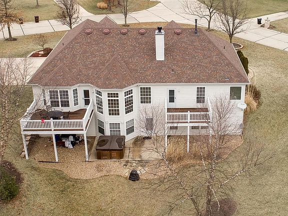 Many angles add interest to the 2yr old hip roof. The large, partly covered patio with spa tub is flanked by two decks.