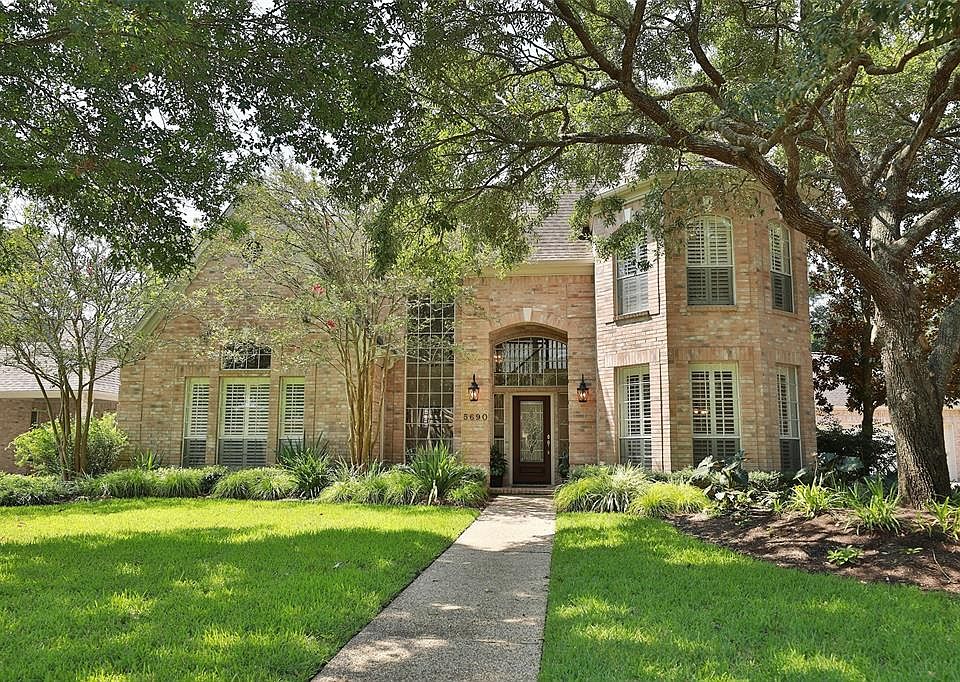 Welcome to 5690 Grand Floral Blvd in West Houston's renowned private community of Twin Lakes.