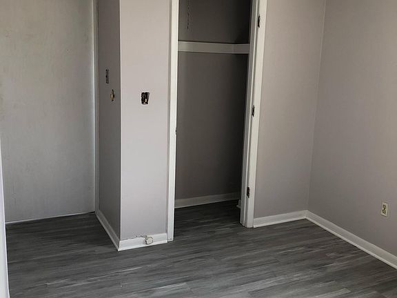 One bedroom with barn door entrance and access to bathroom through bedroom