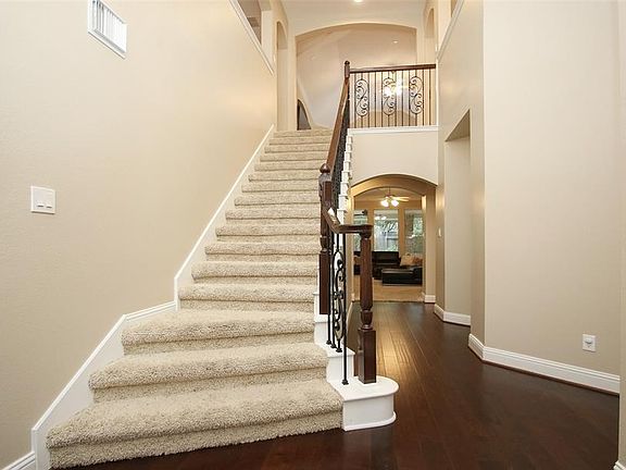 Your first introduction to the home will leave you amazed! Bright and spacious foyer with high ceiling, recent wood flooring and wrought iron carpeted staircase with wood finishes