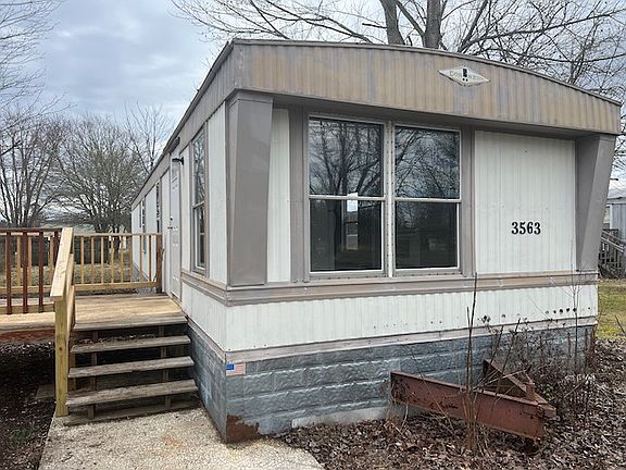 Four steps to front door, parking for two cars