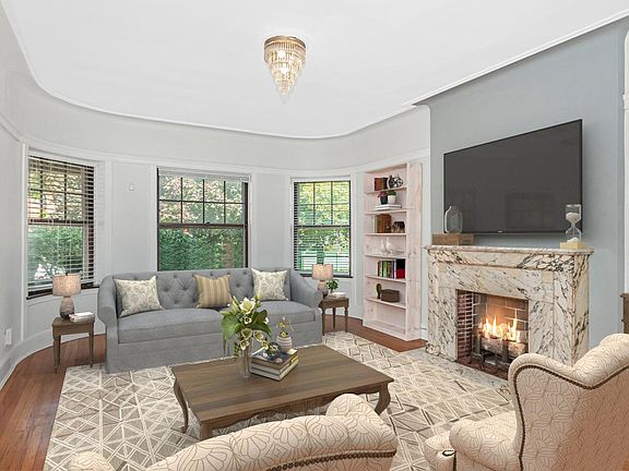 Large Living room with Decorative marbled Fireplace