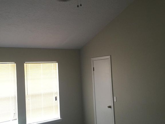 The Master bedroom has a high ceiling