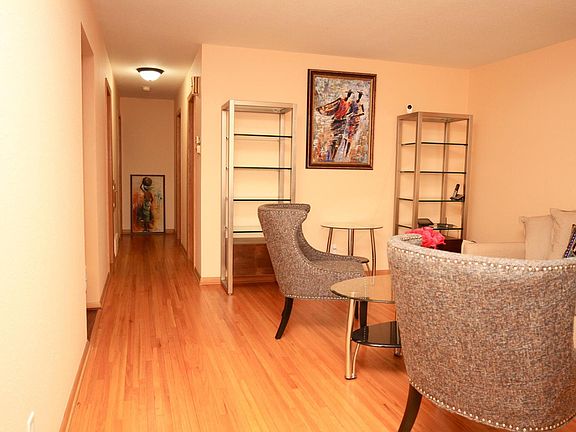 Hallway to the bathroom and three bedrooms