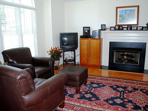 16 x 13 Living room with hardwood floors, gas fireplace and vaulted ceilings