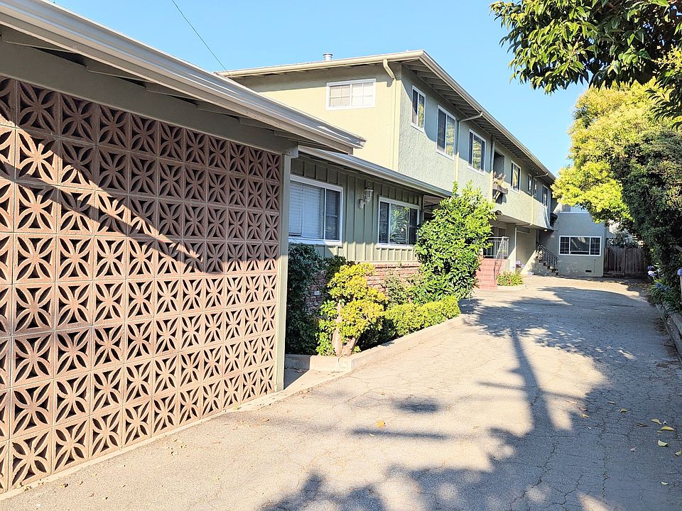 The butterfly bricks are part of Unit 1, the second story and residence in the back are the other five units.