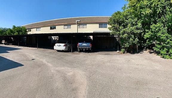 Assigned parking for 2 cars under carport. Corner lot.