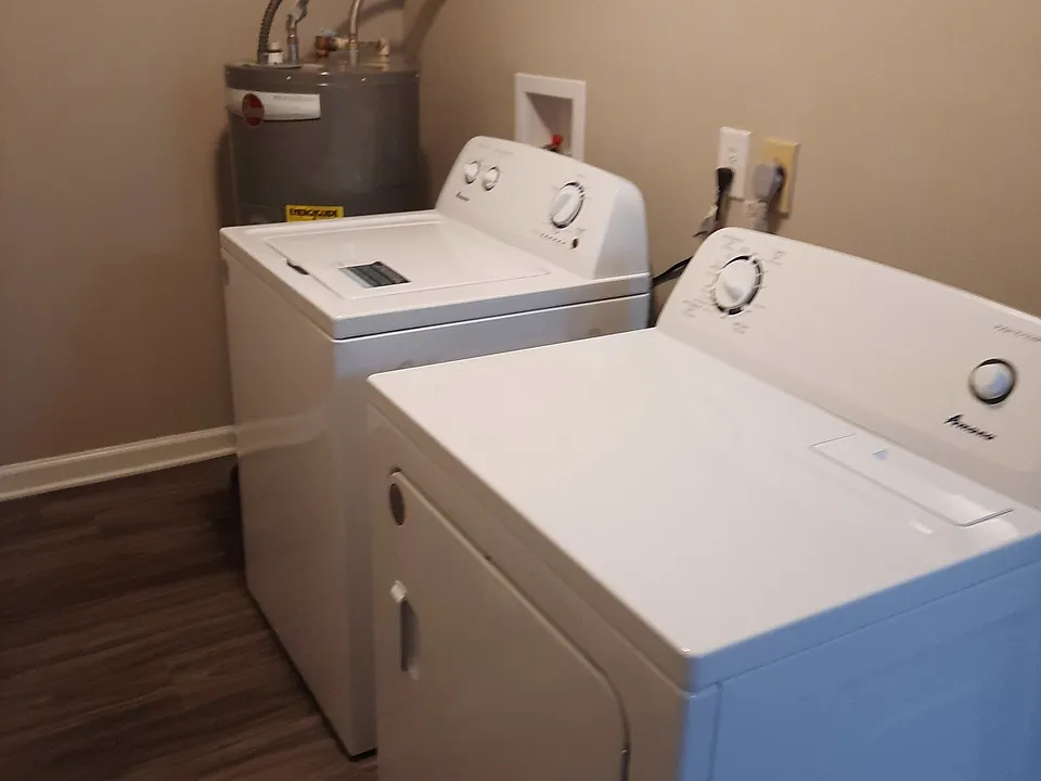 Laundry area in one bedroom apartment with full size washer and dryer