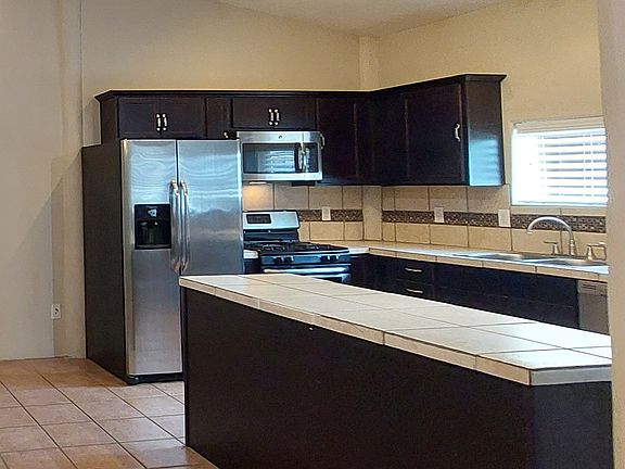 All stainless steal appliances stay; Fridge, Gas Stove, Micro-wave, dishwasher. On top of cabinets space to put your decor; plants, vase etc.