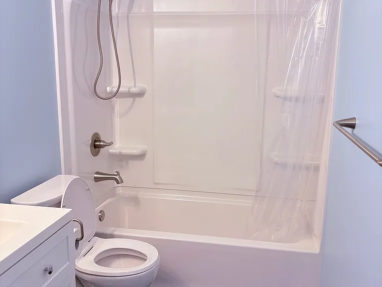 Newly Renovated Full Bath, new tub, toilet, vanity, flooring, sink, mirror and lighting, fresh paint