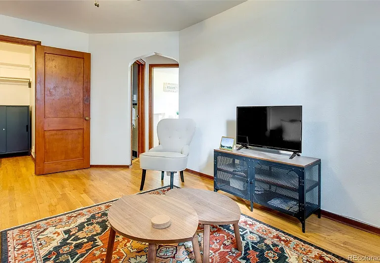 Living Room look toward kitchen. Bonus room/walk in close pictured in left hand back corner of photo