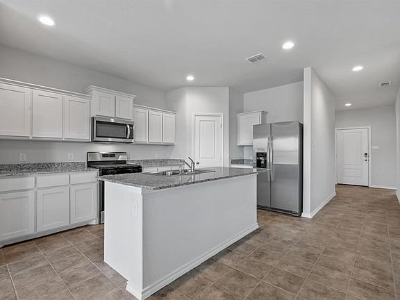 All Photos shown here may not depict the specified home and features and are included for illustration purposes only. Elevations, exterior/ interior colors, options, available upgrades, and standard features will vary in each community and may change without notice. May include options, elevations, and upgrades (such as patio covers, front porches, stone options, and lot premiums) that require an additional charge. Landscaping and furnishings are dÃ©cor items and are not included in purchase price. Call sales agent for more details.