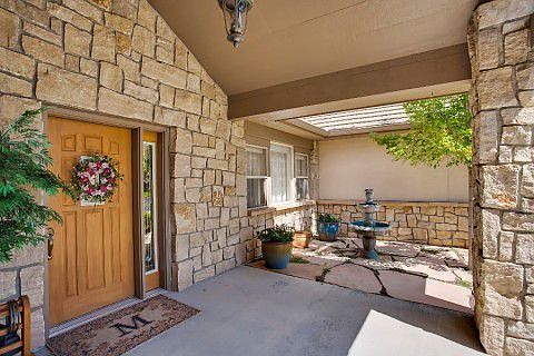 Welcoming entry to home is complete with soothing fountain