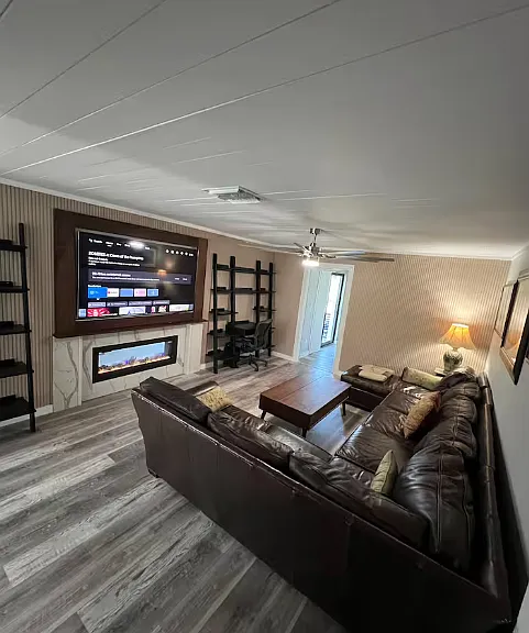 Living room sectional, smart tv with see through gas fireplace