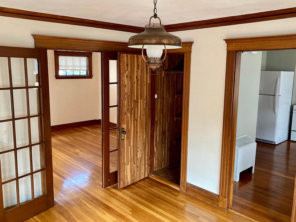 Dining Room with built in cedar closet. Original French doors.