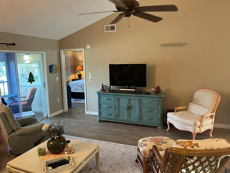 Large living room with vaulted ceiling and open floor plan.