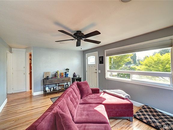 As you enter the home you are welcomed by a light and bright living room with hardwood floors. 