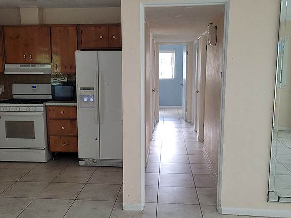 Kitchen and hallway to bath and bedrooms...