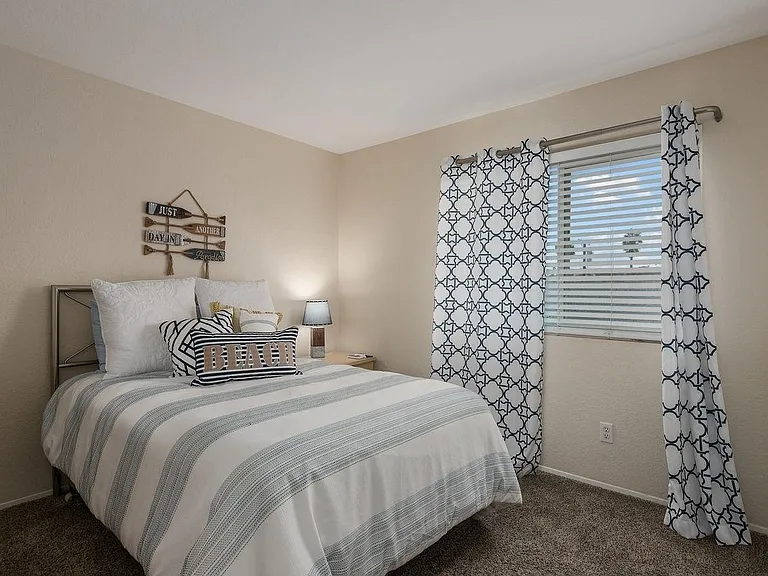 Second bedroom, with bathroom located in the hallway.
