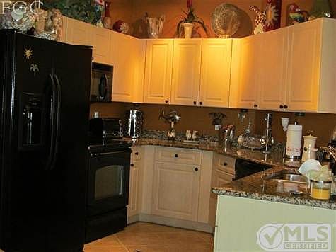 Kitchen with custom lighting and granite countertops