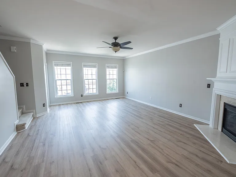 Huge living area with updated fireplace and brand new floors.