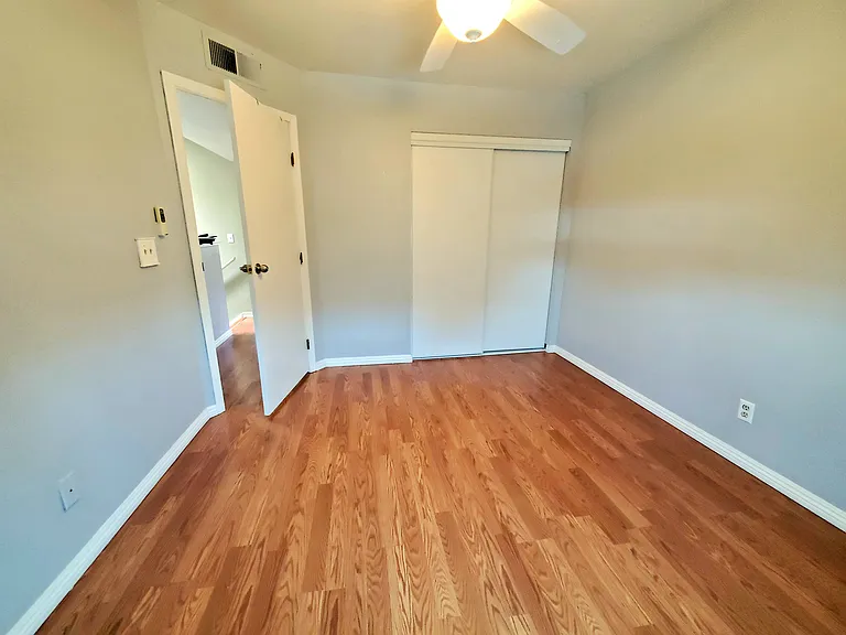 2nd bedroom with dual-pane solar-tinted windows